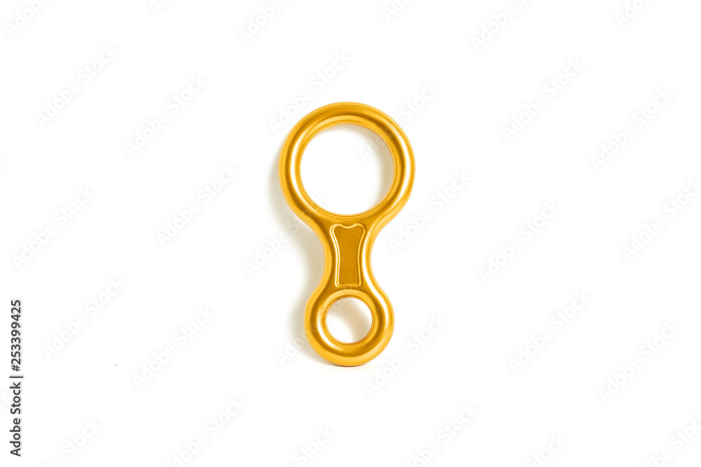 Metal descender isolated on white background. Hiking and mountaineering equipment concept Metal descender isolated on white background. Hiking and mountaineering equipment concept