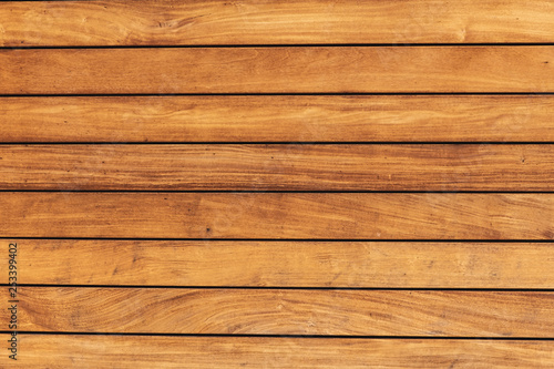 The texture of the pine boards. Horizontal wooden fence.