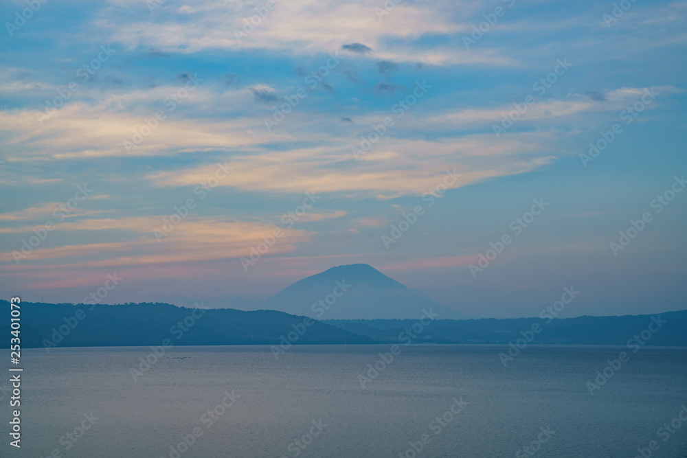 Sunset of the famous Lake Toya with Mount Yotei