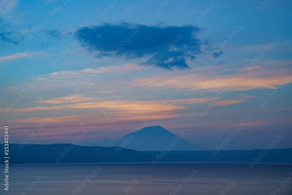 Sunset of the famous Lake Toya with Mount Yotei Sunset of the famous Lake Toya with Mount Yotei