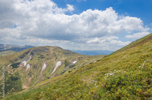 spring mountain range with remnants of snow