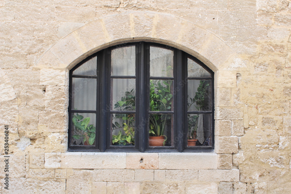 Old window in stone wall