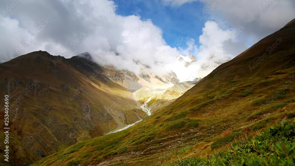 Captivating scene of the alpine valley in sunlight. Main Caucasus ridge. Captivating scene of the alpine valley in sunlight. Main Caucasus ridge.