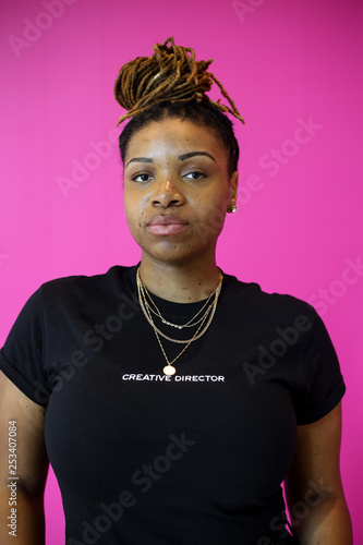 Portrait of woman with freckles and braids