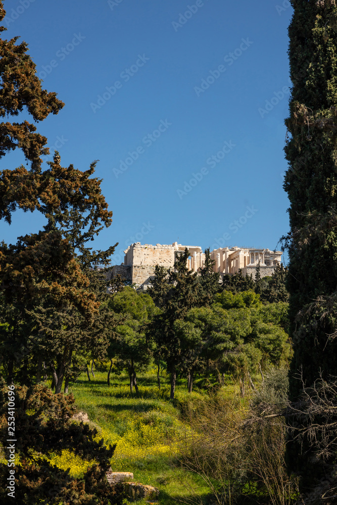 Acrolis of Athens Greece rock and Parthenon on blue sky background, sunny day.