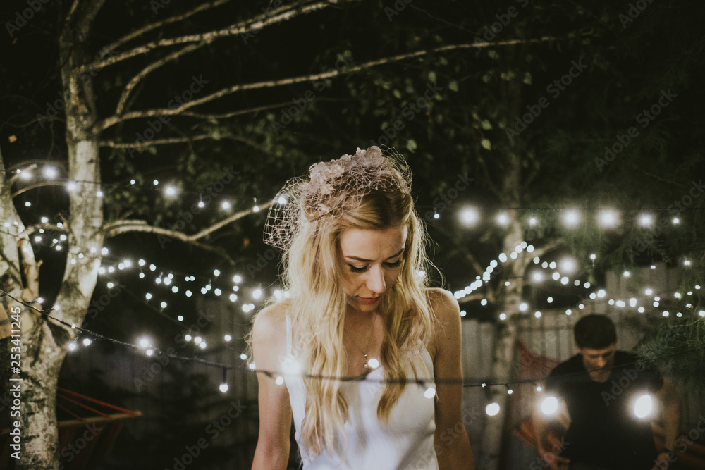 Bride and groom under lights Bride and groom under lights