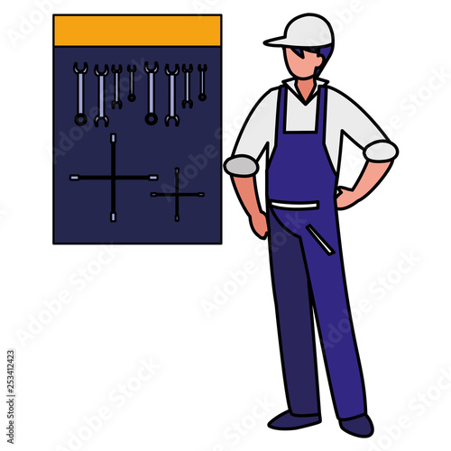 mechanic worker with tools board hanging