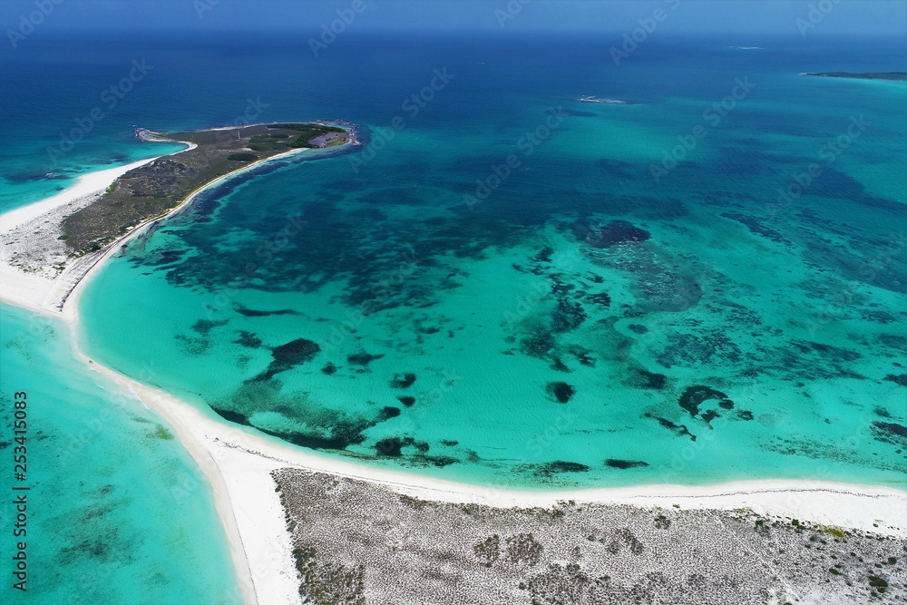 Obraz premium Caribbean sea, Los Roques, Venezuela: vacation on the blue sea and paradisiac beach. Vacation travel. Travel destination. Tropical travel. Great beach scenery. Beautiful landscape.