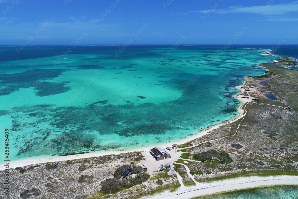 Caribbean sea, Los Roques, Venezuela: vacation on the blue sea and paradisiac beach. Vacation travel. Travel destination. Tropical travel. Great beach scenery. Beautiful landscape. Caribbean sea, Los Roques, Venezuela: vacation on the blue sea and paradisiac beach. Vacation travel. Travel destination. Tropical travel. Great beach scenery. Beautiful landscape.