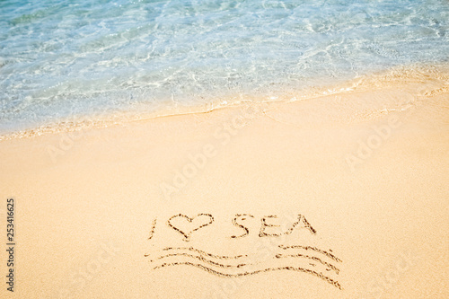 Beautiful drawing on the sand of the sea background