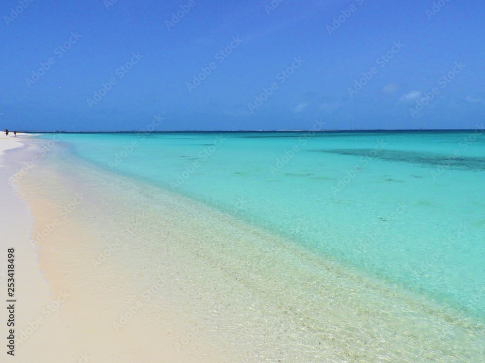 Caribbean sea, Los Roques, Venezuela: vacation on the blue sea and paradisiac beach. Vacation travel. Travel destination. Tropical travel. Great beach scenery. Beautiful landscape.