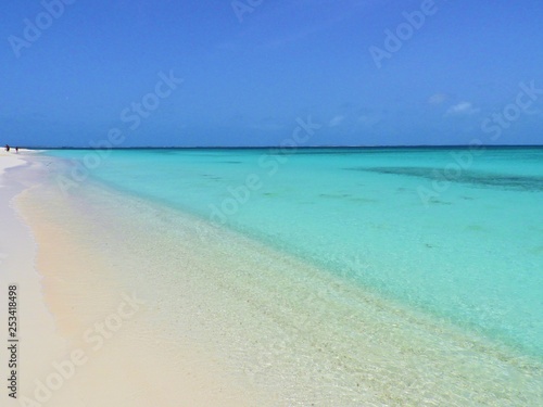 Caribbean sea, Los Roques, Venezuela: vacation on the blue sea and paradisiac beach. Vacation travel. Travel destination. Tropical travel. Great beach scenery. Beautiful landscape.