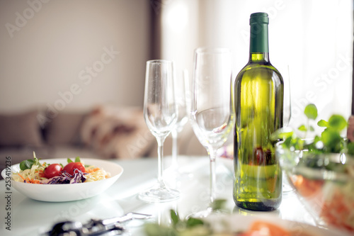 Glasses of wine and a salad on the table