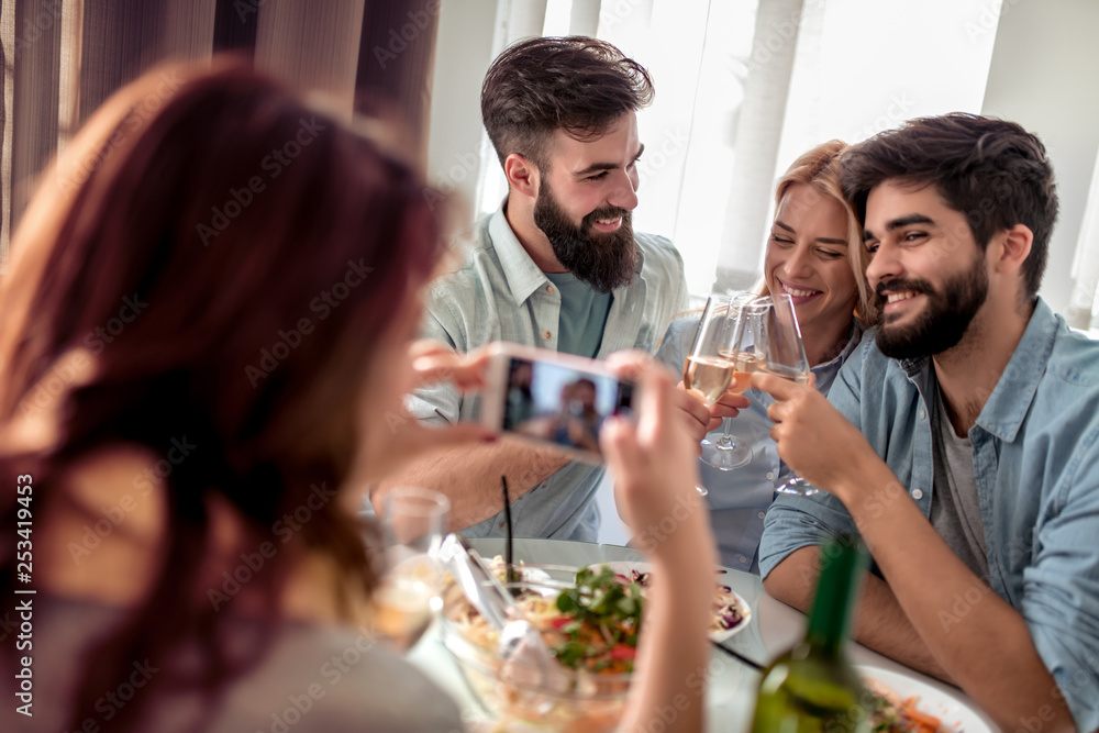 Friends having lunch together at home