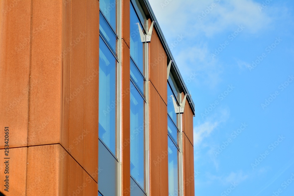 Sky reflected in a modern building glass facade Sky reflected in a modern building glass facade