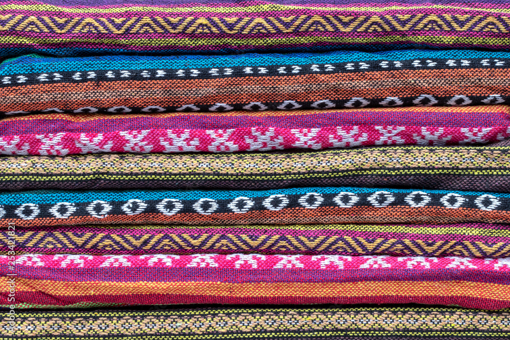 Folded colorful patterned scarves.