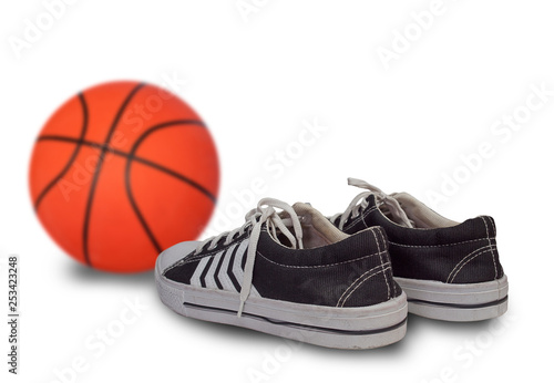 sport shoes and basketball ball.
