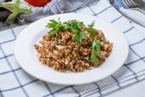 Fried buckwheat porridge with onions and mushrooms