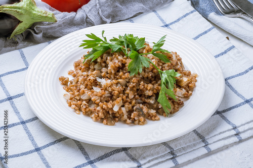 Bild auf Leinwand Fried buckwheat porridge with onions and mushrooms