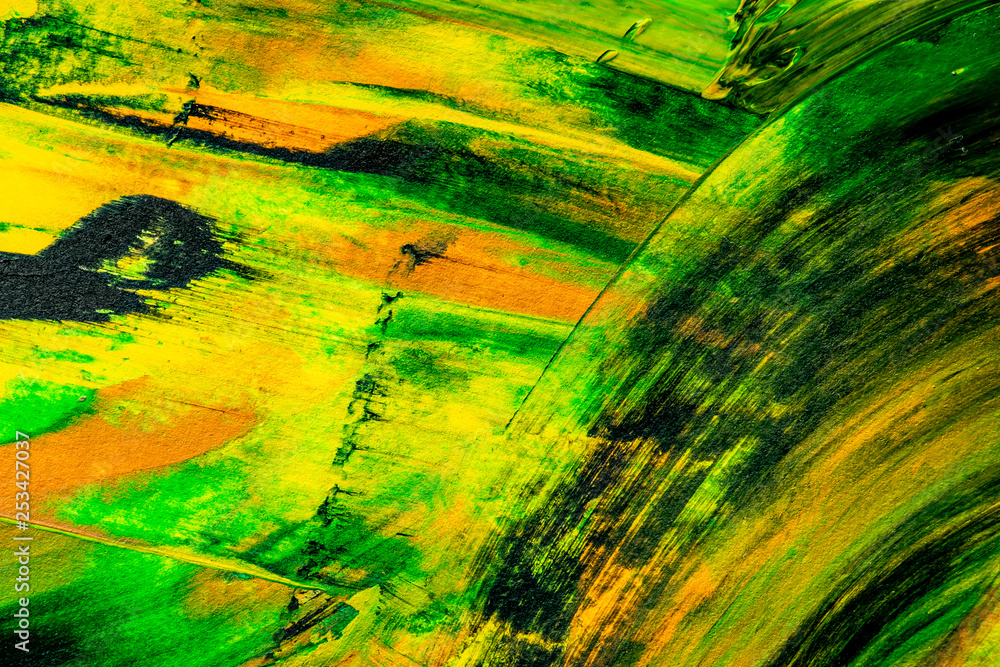 Paint texture abstract background. Colorful macro close up paint brush strokes green, yellow, orange, black. 