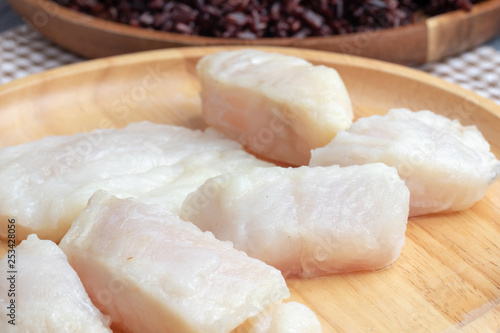 steamed pangasius dory and riceberry rice on wooden plate