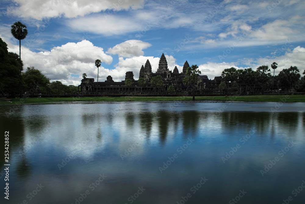 Angkor Wat and cloudy sky reflected in the water in Siem Reap, Cambodia