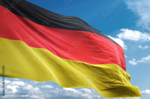Germany flag waving sky background 3D illustration