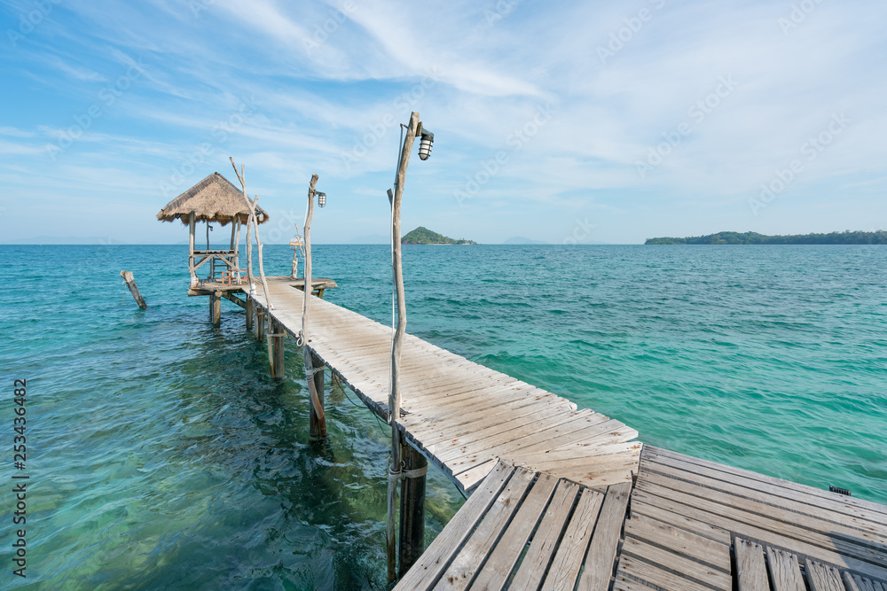 Wooden pier with boat in Phuket, Thailand. Summer, Travel, Vacation and Holiday concept. Wooden pier with boat in Phuket, Thailand. Summer, Travel, Vacation and Holiday concept.