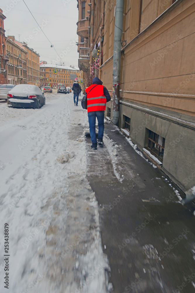 custom made wallpaper toronto digitaljanitor in an orange vest, removing snow from the sidewalk after a snowfall