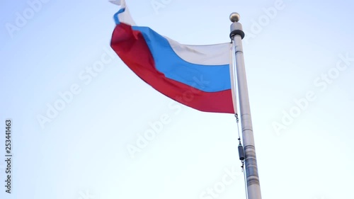 Russian flag flies in wind close up