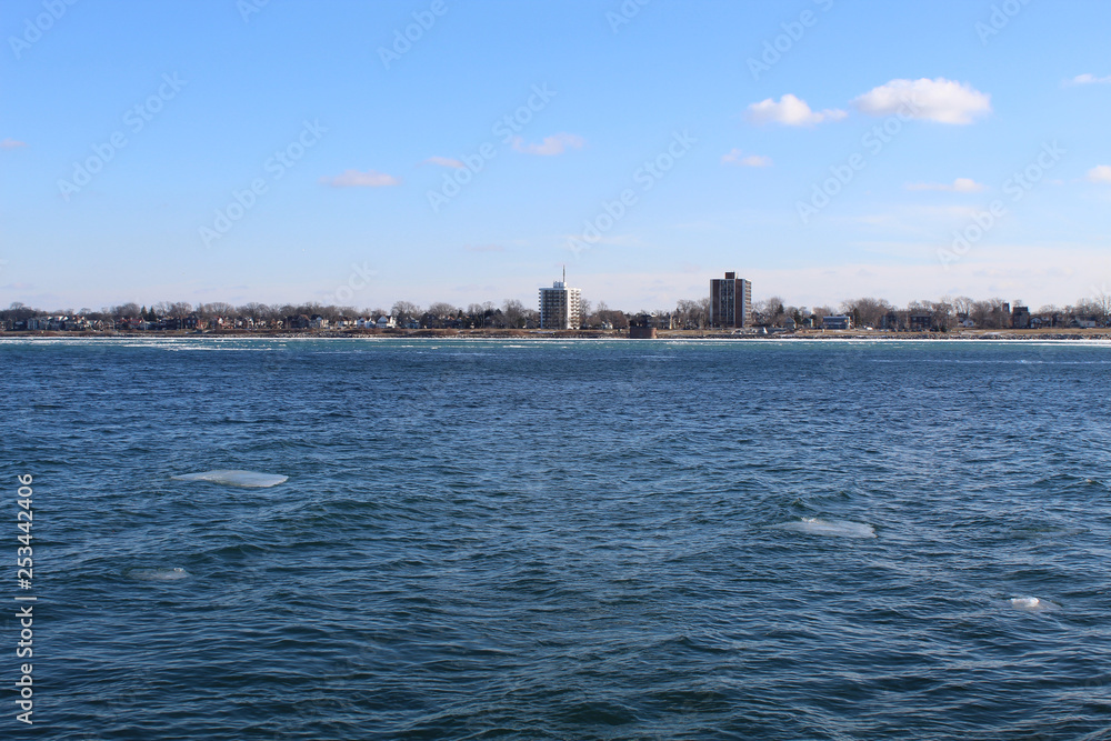 Detroit River in winter with Windsor, Canada in background