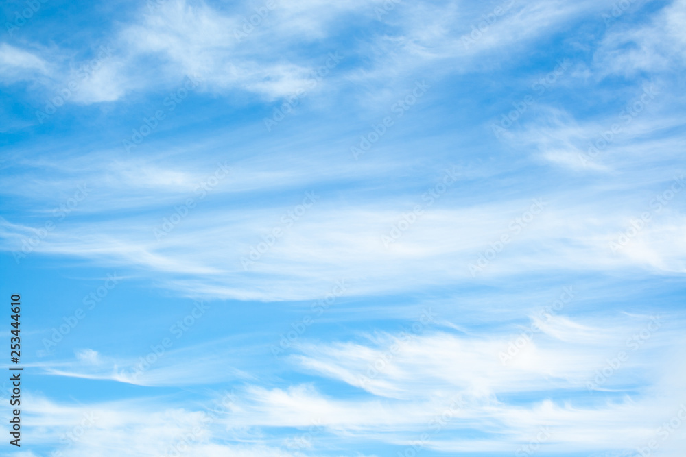 White clouds high in the sky at windy winter day background White clouds high in the sky at windy winter day background