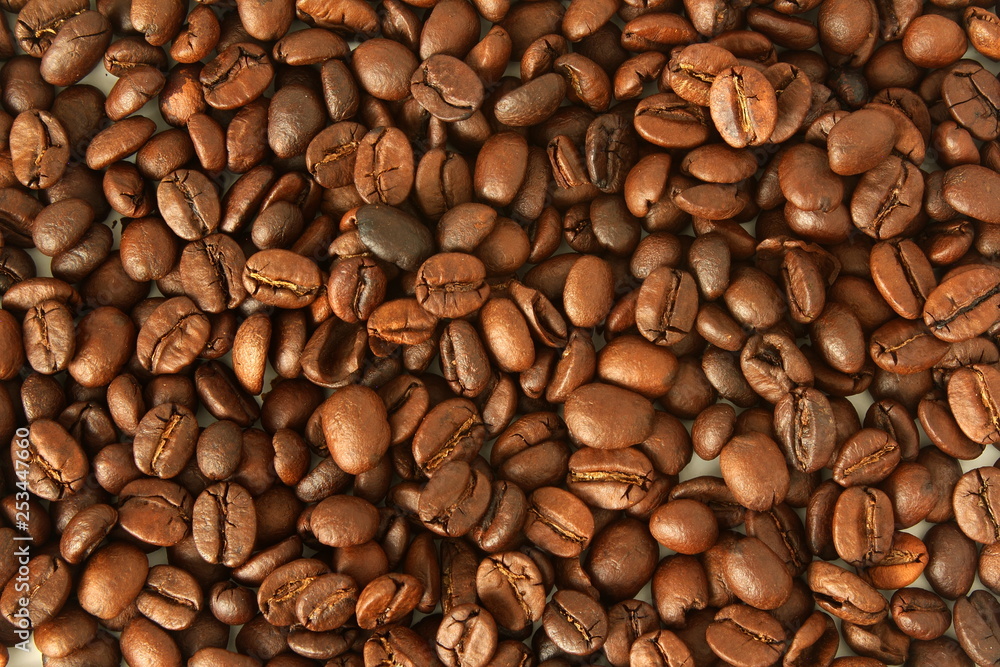 dark roasted coffee beans closeup as background top view dark roasted coffee beans closeup as background top view