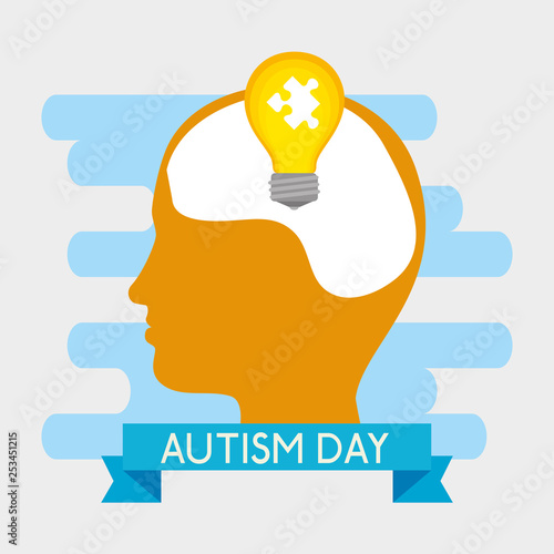 kid silhouette with puzzle inside bulb to autism day photo