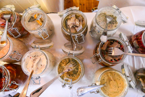 Photography MEDEVI SWEDEN Traditional Julbord or Christmas lunch table with herring selectio