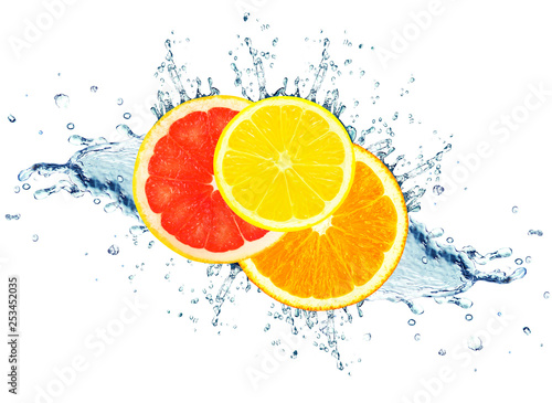 grapefruit, lime and orange water splash isolated on white
