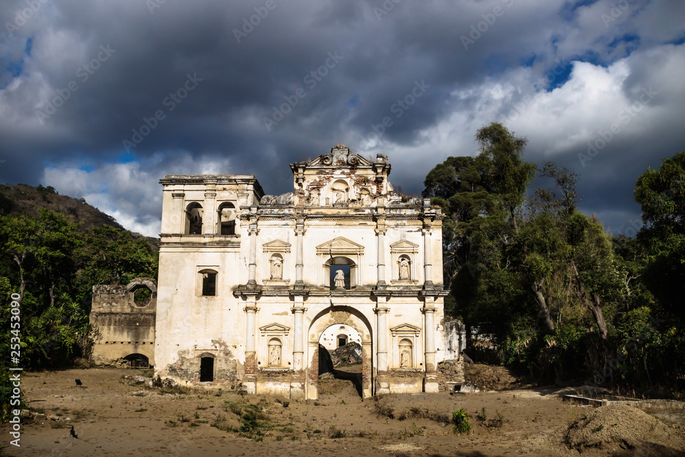 Church fasade ruin under dramatic cloudscape, Antigua, Guatemala