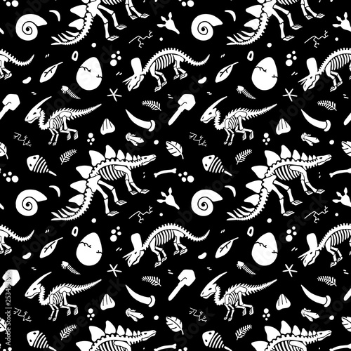 Dinosaur skeleton and fossils. Vector seamless pattern. Original design with dinosaur bones, stones, traces, plants and eggs. Print for T-shirts, textiles, web.Black background.