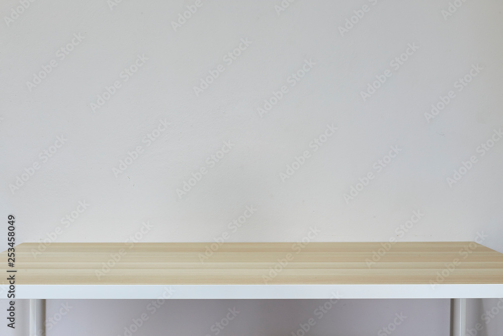 Empty light brown table in white room Empty light brown table in white room