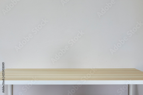 Empty light brown table in white room
