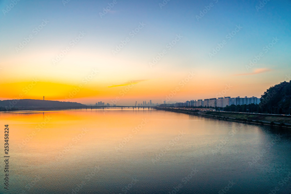 Sunrise at Hun River take picture from Airport Railroad Express (AREX) between Seoul to Incheon Airport , Seoul in South Korea.