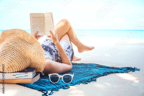 Photography Summer Beach Holiday Woman reading a book on the beach in free time