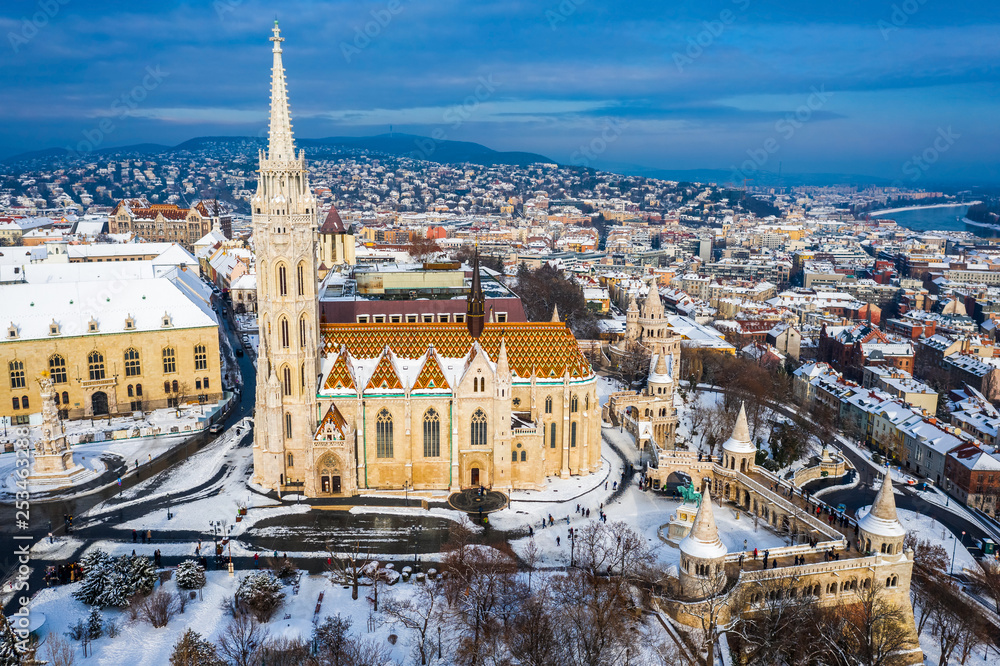 Budapest, Hungary - Snowy Fisherman's Bastion (Halaszbastya) and Matthias Church taken from above at winter time