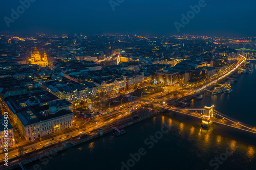 Budapest  Hungary - Aerial skyline view of Pest side of Budapest with illuminated Szechenyi Chain Bridge and St. Stephen s Basilica at blue hour