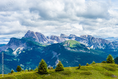 Alpe di Siusi, Seiser Alm with Sassolungo Langkofel Dolomite, a view of a large mountain in the background