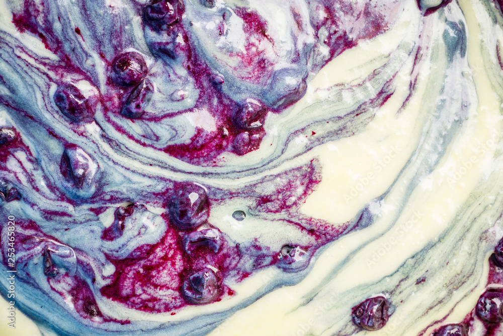 Obraz premium Muffins making. Raw dough mixing with berries. Selective focus.