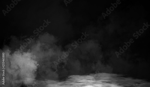 Smoke on the floor . Isolated black background . Misty fog effect texture overlays for text or space
