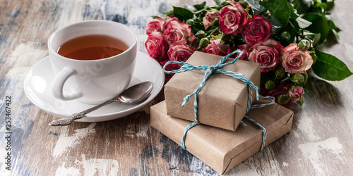 Wallpaper Mural Banner. Roses, gifts, a cup of tea on a wooden background. Valentine's day concept Torontodigital.ca