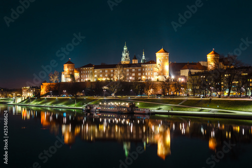 The Royal Wawel Castle as seen from another bank of Vistula. Krakow is the most famous landmark in Poland. Night view © dziewul