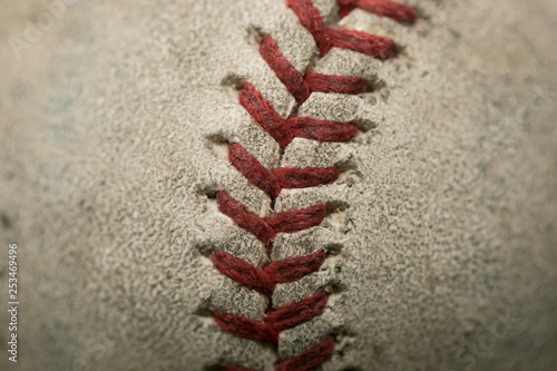 Close up of old baseball stiches photo